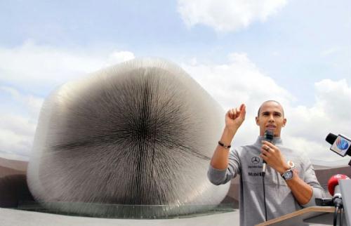 Great&nbsp;Britain's&nbsp;Lewis&nbsp;Hamilton&nbsp;of&nbsp;McLaren&nbsp;F1&nbsp;team&nbsp;answers&nbsp;questions&nbsp;to&nbsp;the&nbsp;media&nbsp;in&nbsp;front&nbsp;of&nbsp;the&nbsp;UK&nbsp;Pavilion&nbsp;in&nbsp;World&nbsp;Expo&nbsp;Park&nbsp;in&nbsp;Shanghai,&nbsp;east&nbsp;China,&nbsp;April&nbsp;15,&nbsp;2010.&nbsp;Hamilton&nbsp;is&nbsp;here&nbsp;for&nbsp;the&nbsp;F1&nbsp;Grand&nbsp;Prix&nbsp;slated&nbsp;on&nbsp;Sunday.&nbsp;(Xinhua/Fan&nbsp;Jun)