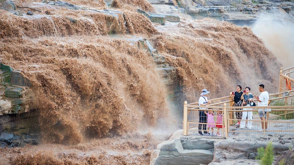 The Hukou Waterfall surged with roaring power