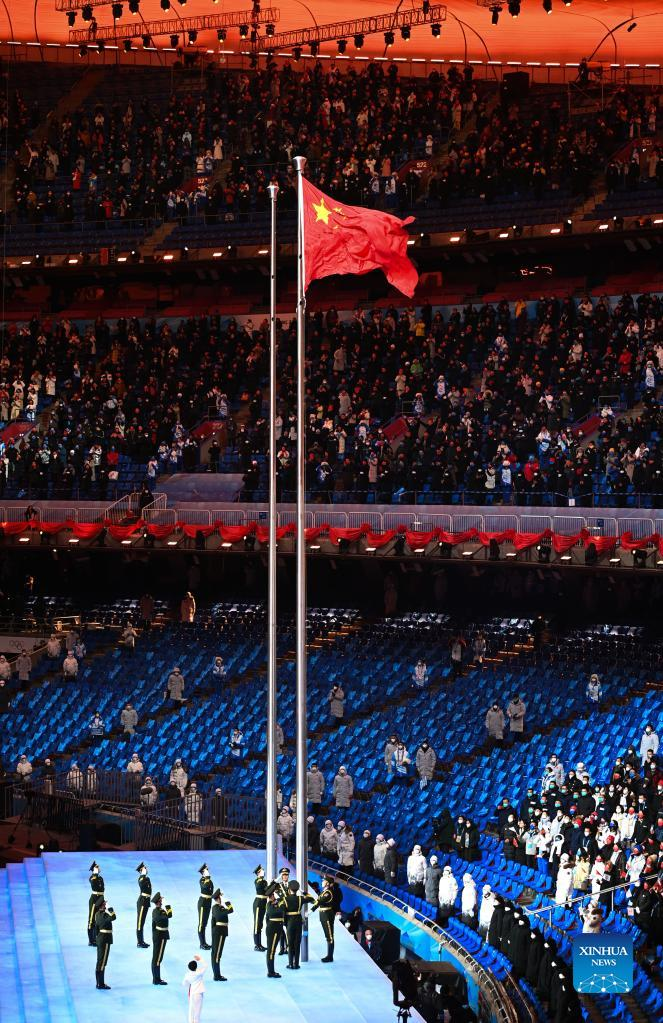 The Chinese national flag is raised during the opening ceremony of the Beijing 2022 Olympic Winter Games at the National Stadium in Beijing, capital of China, Feb. 4, 2022. (Xinhua/Li Ziheng)